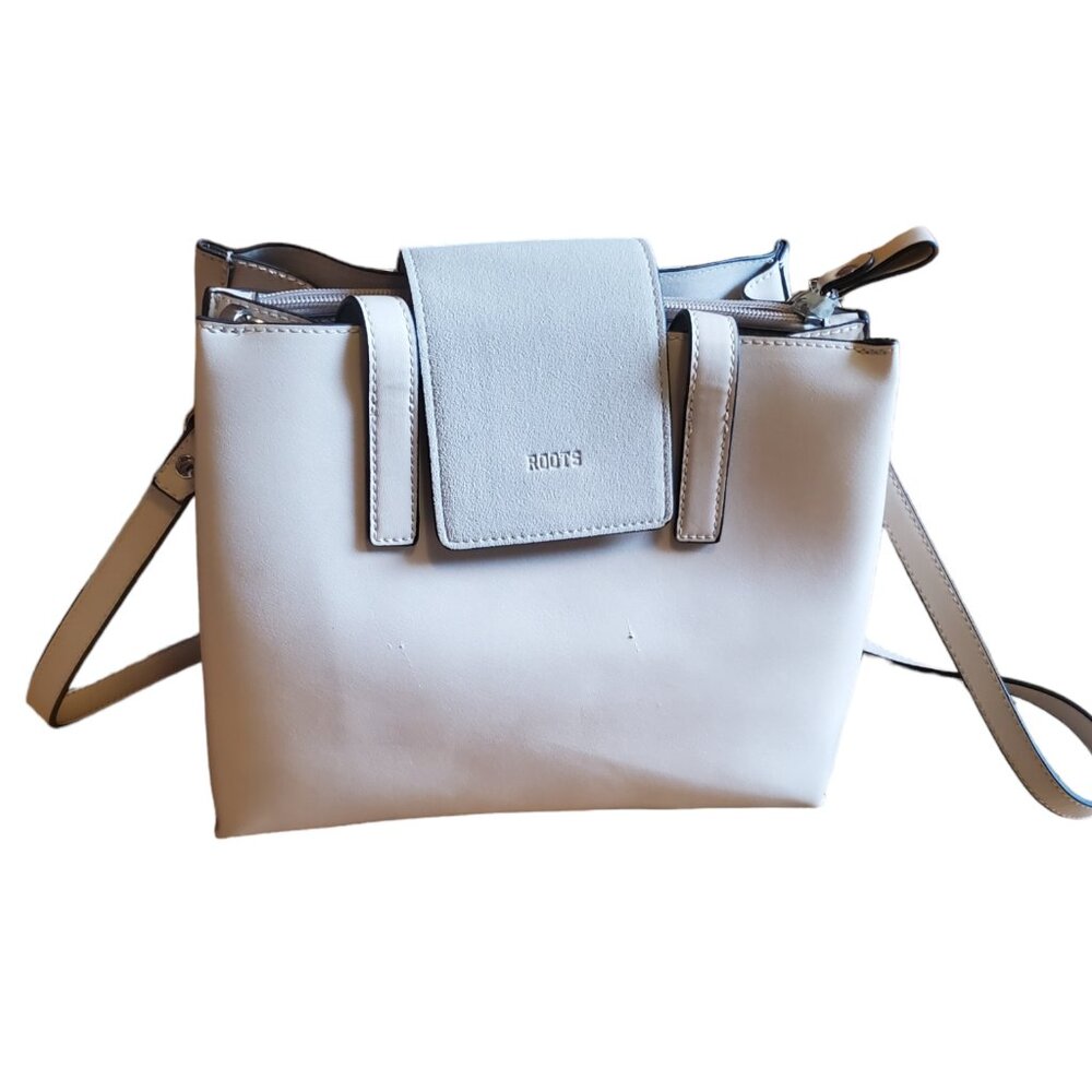 Cream colored Roots Handbag